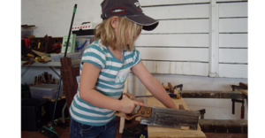 Kid Sawing Wood