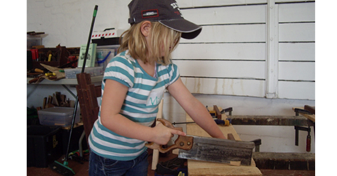 Kid Sawing Wood